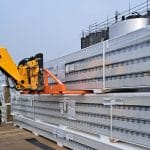 Four Fork Attachment unloading cladding panels from a delivery vehicle